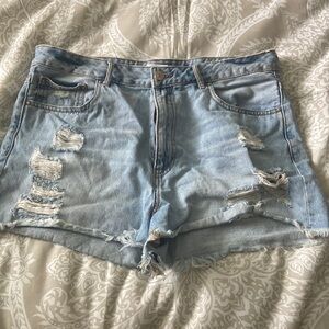 Jean shorts with distressing on both sides.
